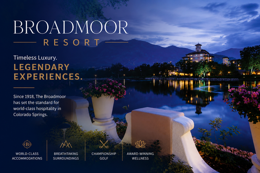 Promotional image of The Broadmoor Resort with a scenic view of the resort at night.